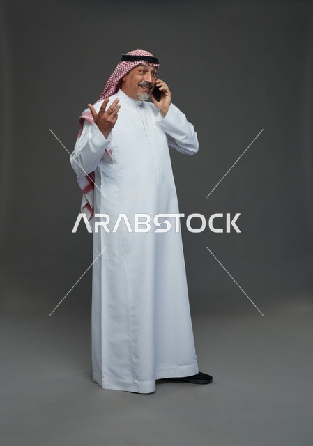 Elderly Saudi Man Smiling While Talking on Phone