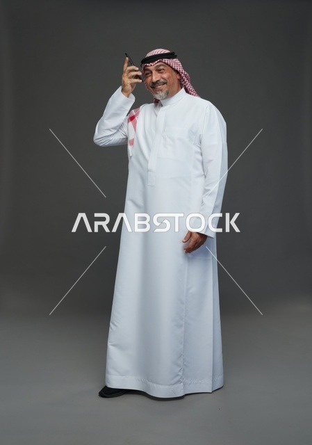 Elderly Saudi Man Talking on Mobile Phone Studio