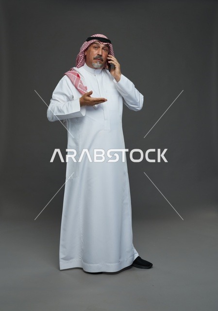 Elderly Saudi Man Talking on Smartphone in Studio