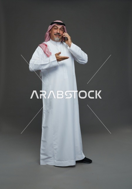 Elderly Saudi Man Talking on Smartphone in Studio