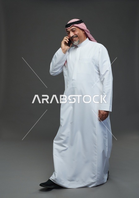 Elderly Saudi Man Talking on Phone in Studio