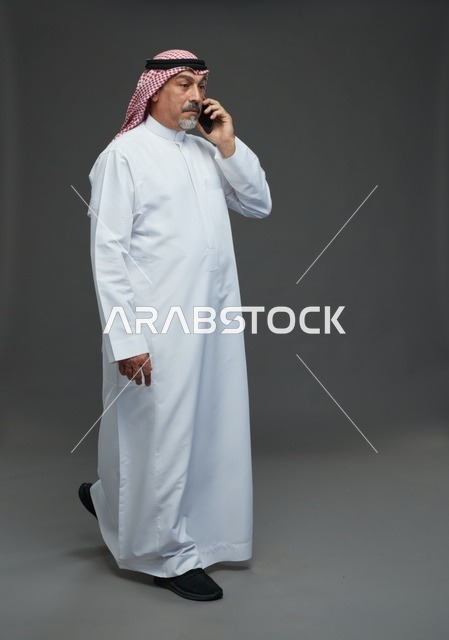 Elderly Saudi Man Talking on Phone in Studio