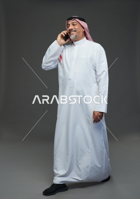 Saudi Elderly Man Talking on Mobile Phone Studio