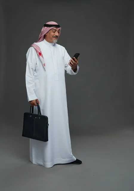 Saudi Businessman with Briefcase and Smartphone