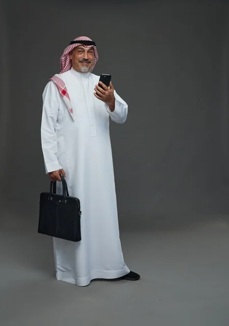 Saudi Businessman with Phone and Briefcase in Studio