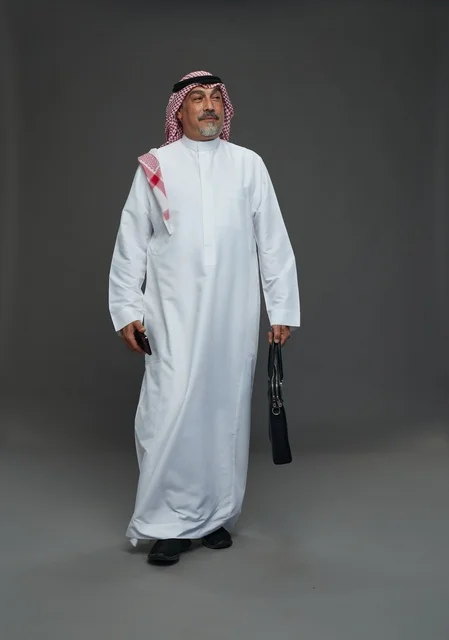 Senior Saudi Businessman with Briefcase and Smartphone