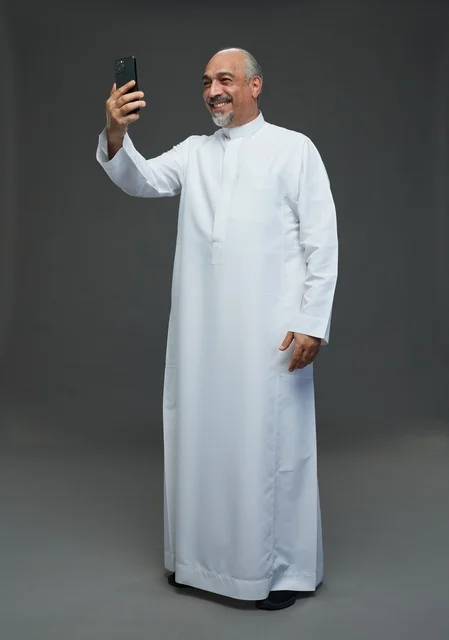 Elderly Saudi Man Taking Selfie with Smartphone