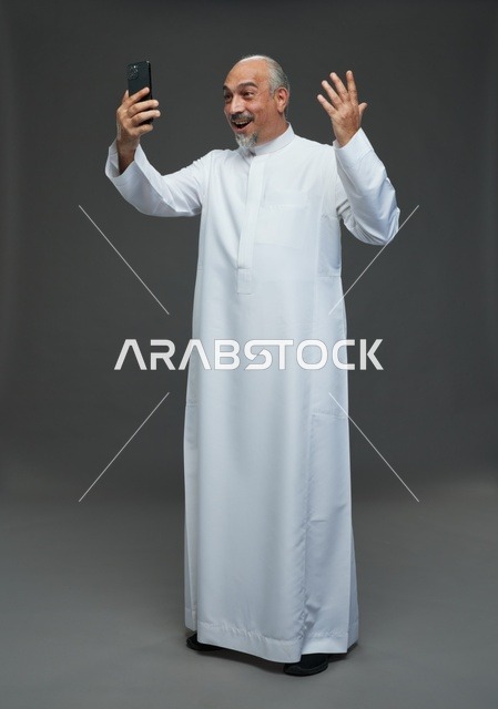Saudi Elderly Man Using Smartphone for Video Call