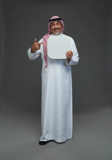 Senior Saudi Man Holding Blank White Advertising Board