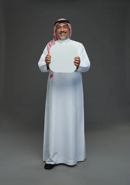 Senior Saudi Man Holding Blank White Advertising Board