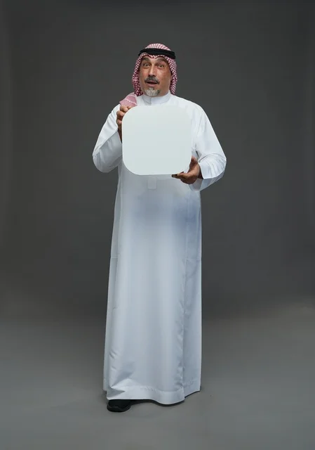 Elderly Saudi Man Holding Blank White Advertising Board