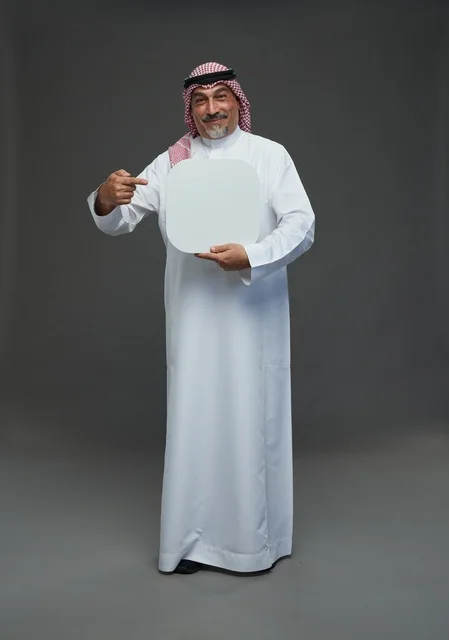 Senior Saudi Man Holding Blank Advertisement Sign