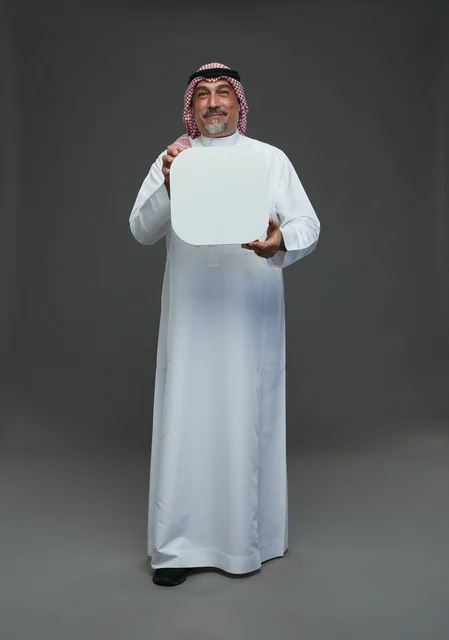 Senior Saudi Man Holding Blank White Advertising Board