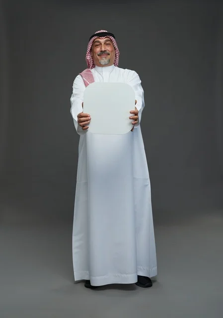Senior Saudi Man Holding Blank White Advertising Board
