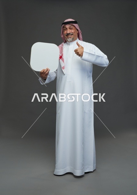 Senior Saudi Man Holding Blank Sign with Thumbs Up
