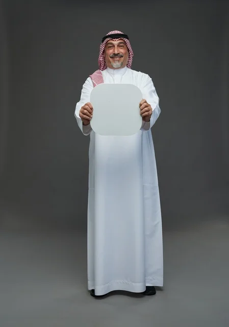 Senior Saudi Man Holding Blank White Sign Board