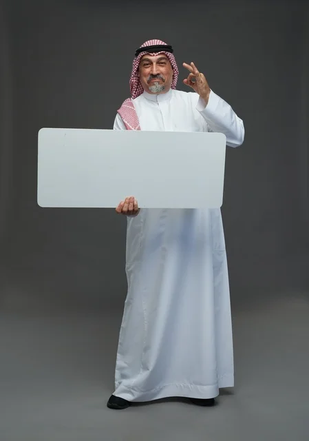 Elderly Saudi Man Holding Blank White Sign Board