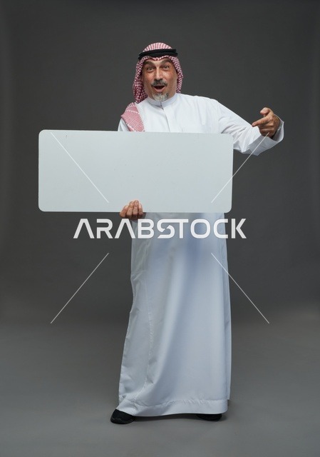 Elderly Saudi Man Holding Blank Signboard with Surprise