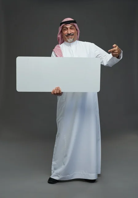 Senior Saudi Man Holding Blank White Advertisement Board