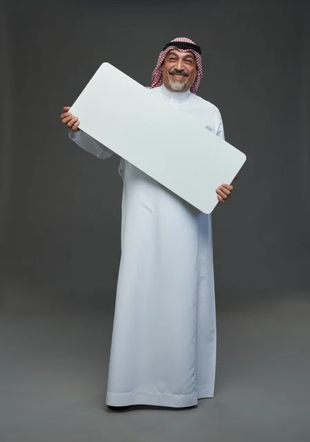 Senior Saudi Man Holding Blank White Advertising Board