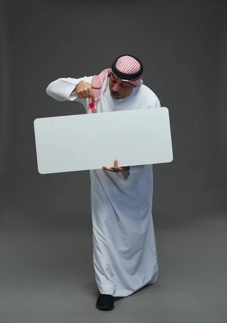 Saudi Elderly Man Holding Blank White Advertising Board
