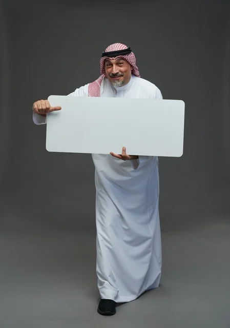 Elderly Saudi Man Holding Blank White Advertising Board