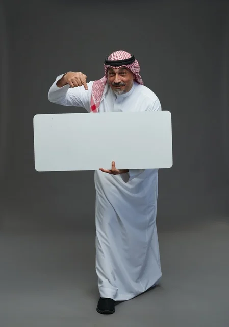 Elderly Saudi Man Holding Blank White Advertising Board