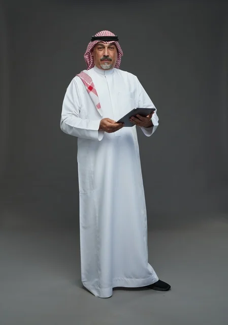 Senior Saudi Man with Tablet in Studio