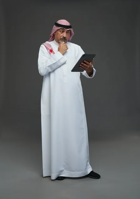 Saudi Senior Man Holding Digital Tablet Grey Background