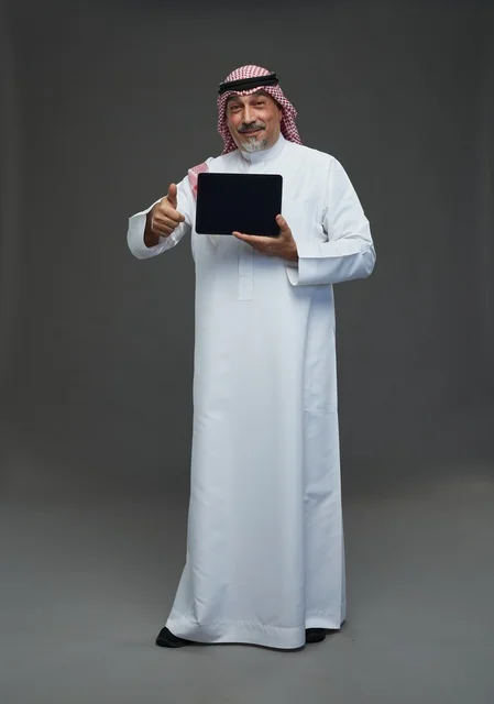 Elderly Saudi Man Holding Tablet with Thumbs Up