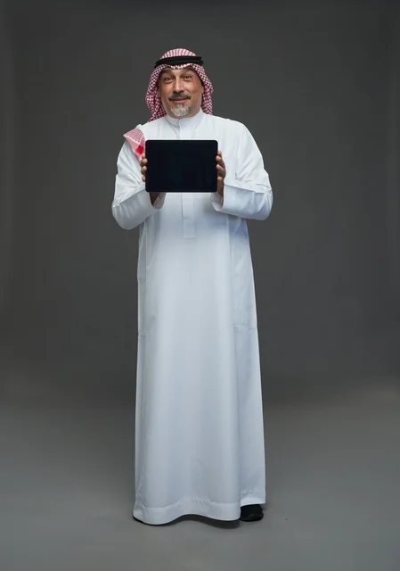 Elderly Saudi Man Holding Digital Tablet in Studio