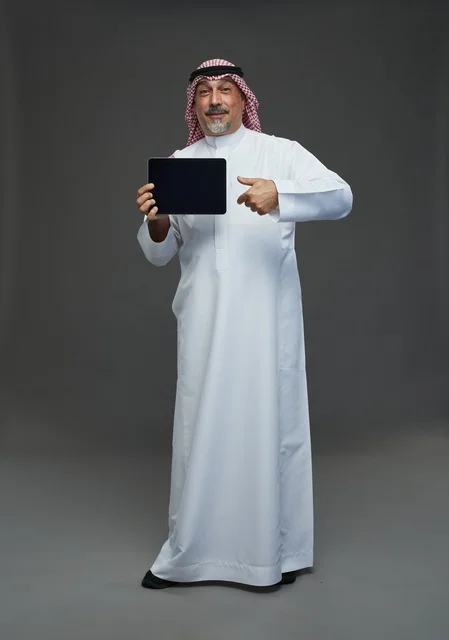 Senior Saudi Man Using Digital Tablet in Studio