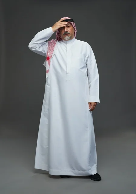 Elderly Saudi Man With Headache on Grey Background