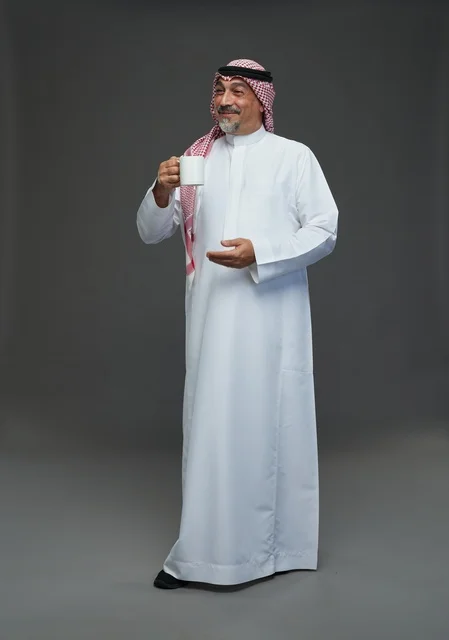 Elderly Saudi Man with White Coffee Mug in Studio