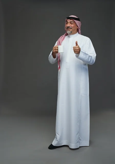 Saudi Elderly Man with Coffee Mug Thumbs Up
