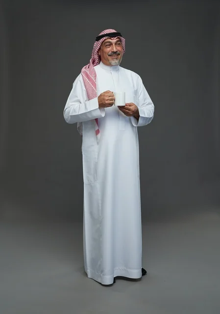 Saudi Senior Man with White Coffee Mug in Studio
