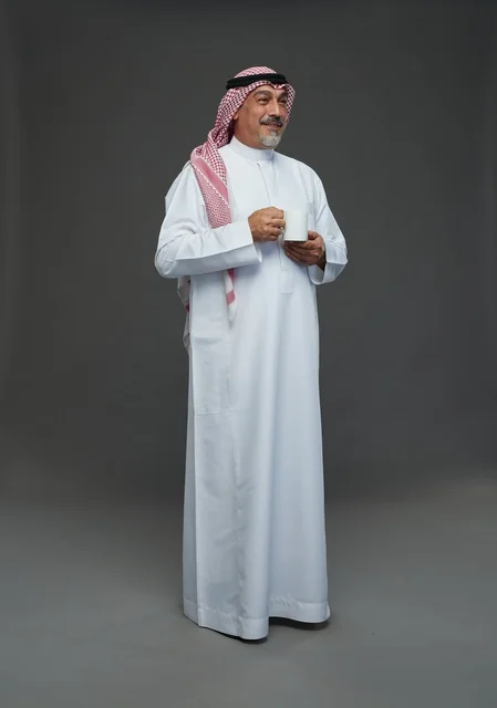 Elderly Saudi Man Holding White Coffee Cup