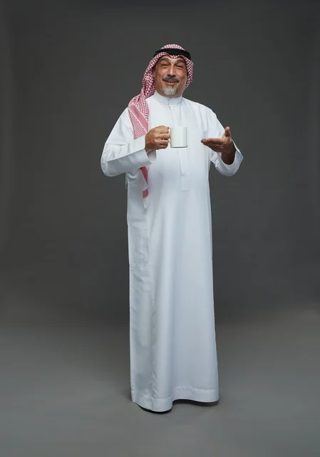 Saudi Elderly Man Holding White Coffee Mug