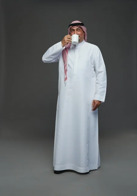 Saudi Elderly Man Drinking Coffee in Studio