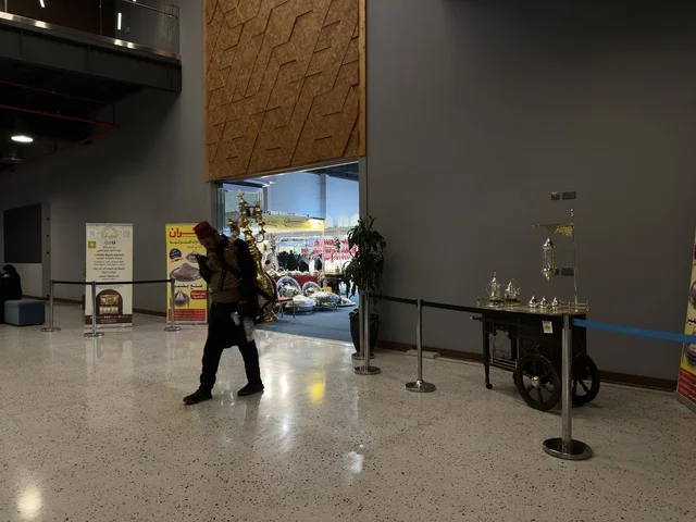 Man Walking at Hala February Exhibition Dhahran Expo