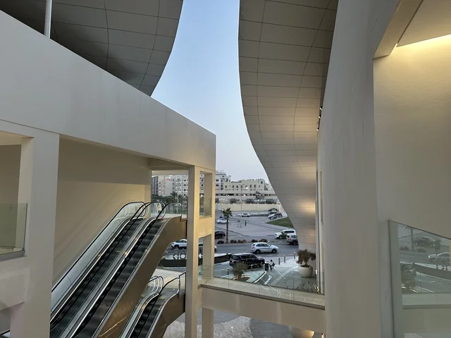 Modern White Architecture with Escalators Urban View