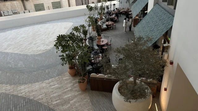 Outdoor Cafe Terrace with Potted Plants High Angle View