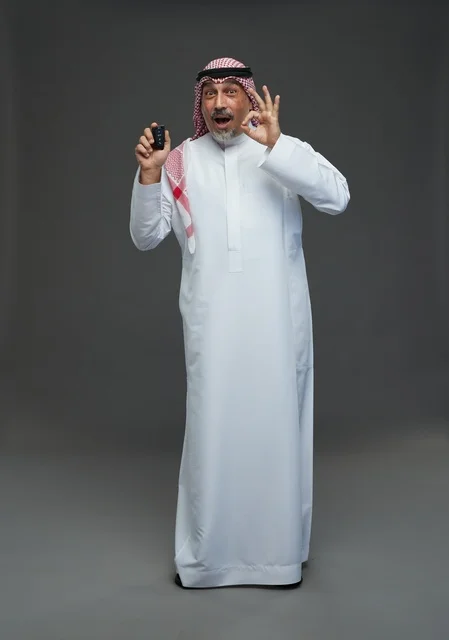 Saudi Man Holding Car Key With Okay Hand Gesture