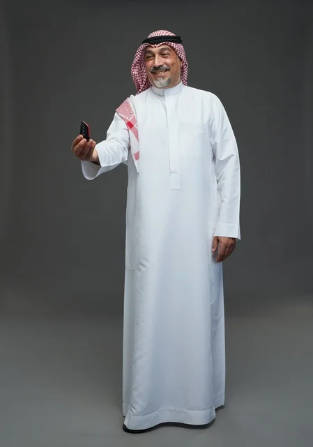 Saudi Man Holding Car Key in Studio