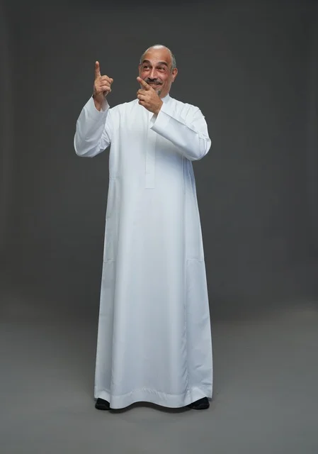 Saudi Man in White Thobe Pointing Up in Studio