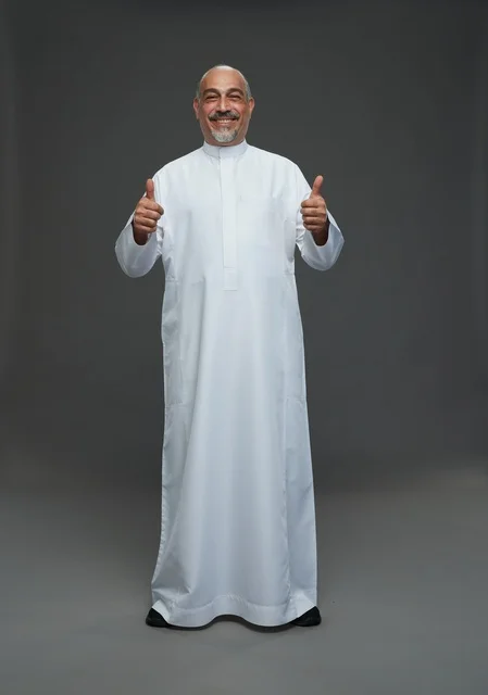 Smiling Saudi Man Giving Double Thumbs Up in Studio