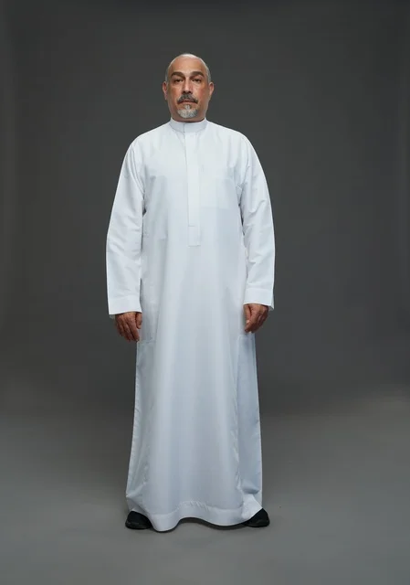 Senior Arab Man in Traditional White Thobe Studio Portrait