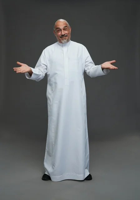 Smiling Arab Man in White Thobe Welcoming Gesture