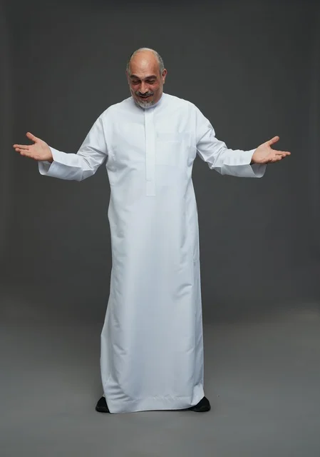 Saudi Man in White Thobe Gesturing in Studio