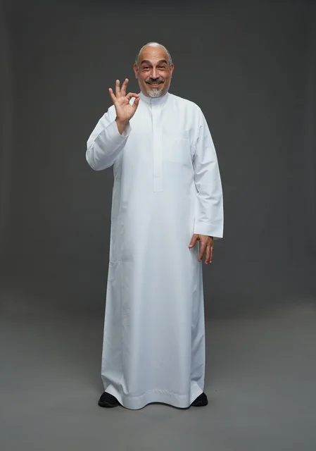 Saudi Man in White Thobe Making OK Gesture